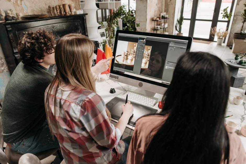 A focused designer works on a user-centric project in a modern office environment.